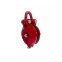 Solid red pulley block with shackle mount for lifting loads