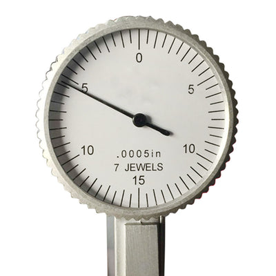 Compact arc welding machine in red with included welding tools and safety gear.