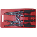 mechanic using snap ring pliers to remove retaining ring from automotive part