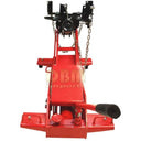 Red hydraulic transmission jack for engine and gearbox removal in auto shops
