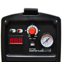 Compact red plasma cutter unit with carry strap, digital control panel and air inlet, displayed with cutting torch and grounding lead.