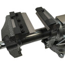 Metal fabrication vise with press brake bending attachment installed on jaws.